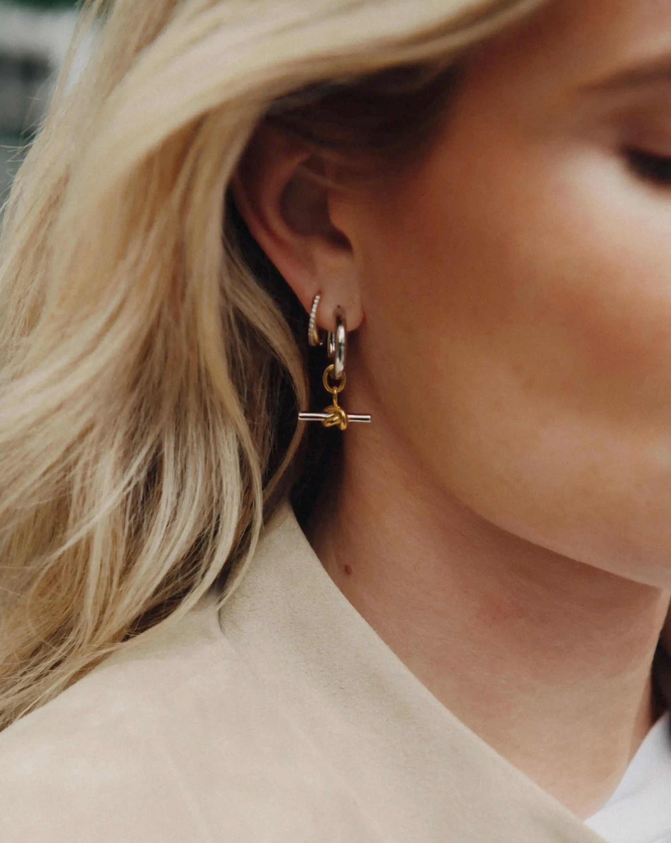 Lucy Williams Knot T-Bar Charm Hoop Earrings worn by a customer