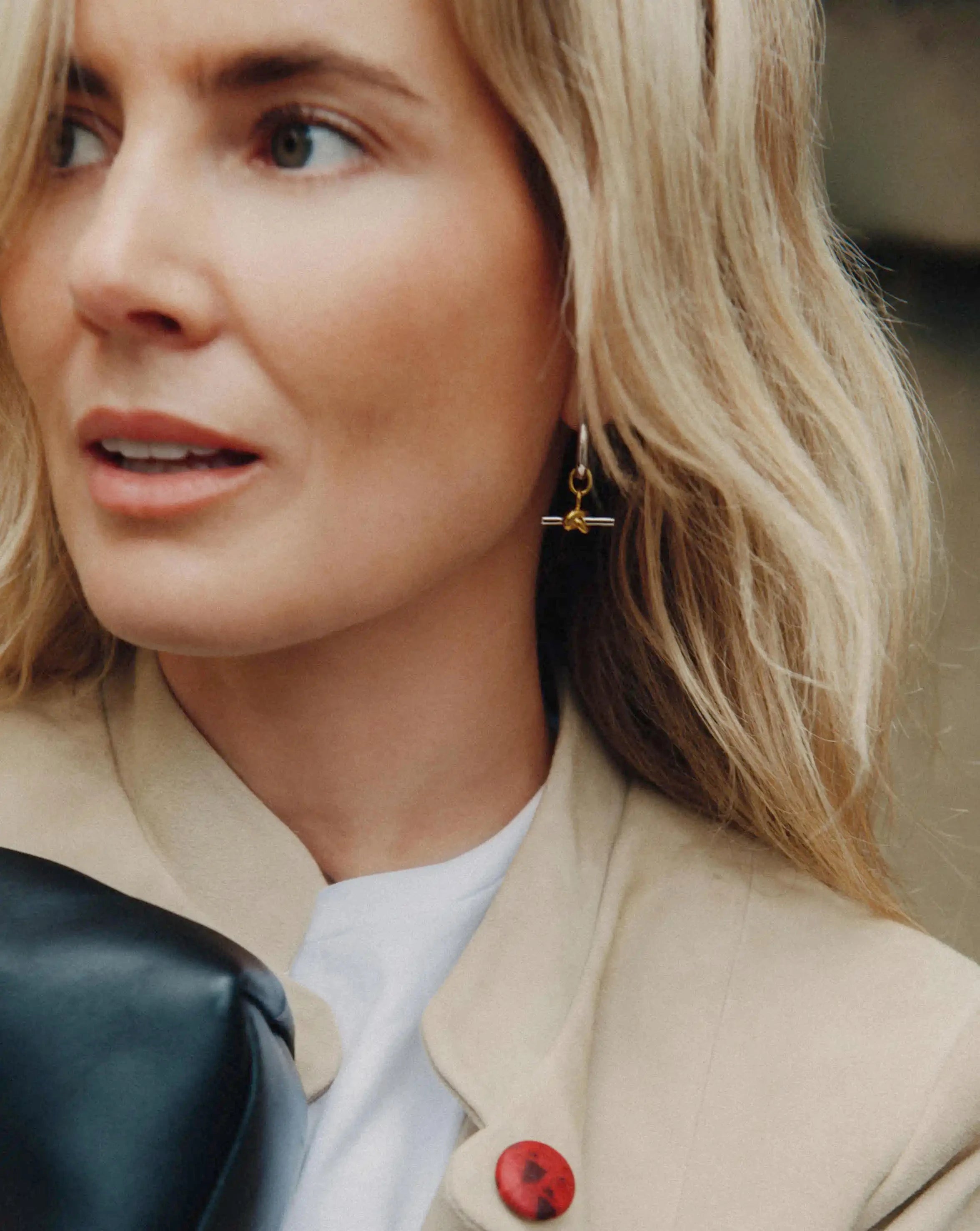 Lucy Williams Knot T-Bar Charm Hoop Earrings worn by a customer